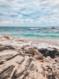 Scenic view of beach against sky