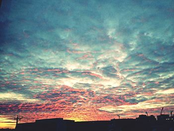 Low angle view of cloudy sky at sunset