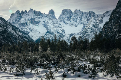 Scenic view of snowcapped mountains against mountain