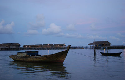 Boats moored in sea