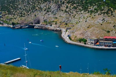 High angle view of sailboats in sea