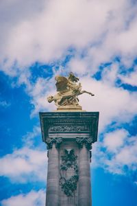 Low angle view of statue against sky