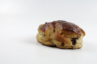 Close-up of bread against white background