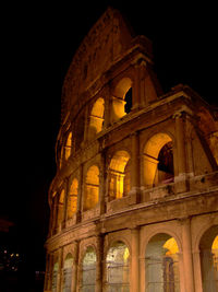 Low angle view of historical building at night