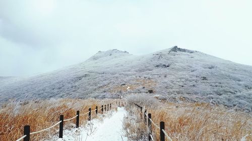 Scenic view of snowcapped mountains against sky