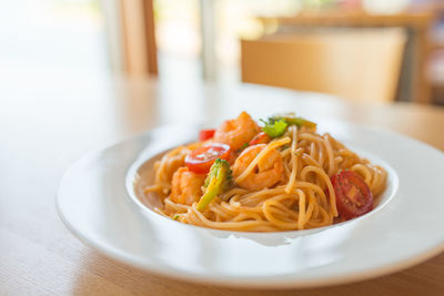 Close-up of serving noodles in bowl