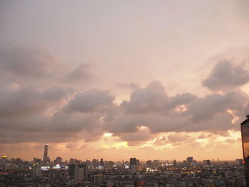 Cityscape against sky during sunset