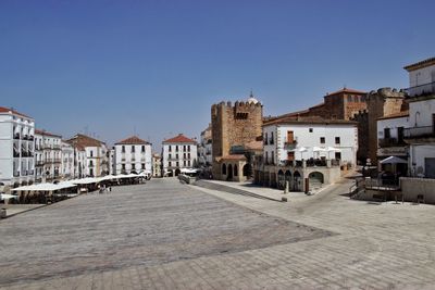 View of city against clear blue sky