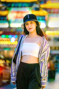 Portrait of smiling young woman standing outdoors