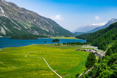 Upper engadine, lake sils, and the village of isola, photographed from above in summer.