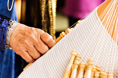 Close-up of man playing piano