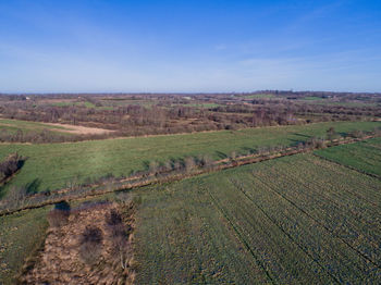 Field against clear blue sky