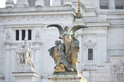 Low angle view of statue of historic building