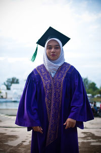 Mid adult man standing against the sky