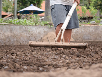 Working on the production of natural sea salt. production of sea salt in the bali,indonesia. 