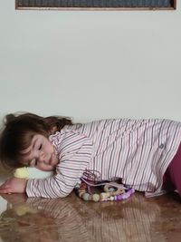 Portrait of smiling girl on floor