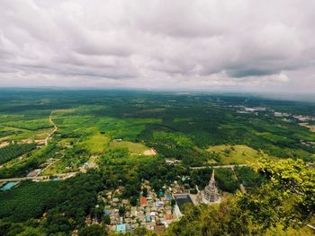 Aerial view of agricultural landscape against dramatic sky