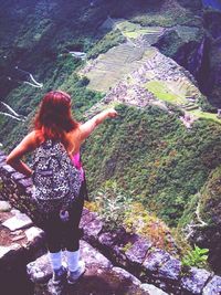 Woman standing on rock
