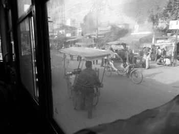 Panoramic view of man and cars on window