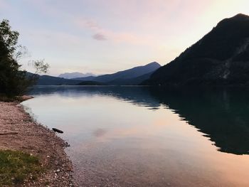 Scenic view of lake against sky during sunset