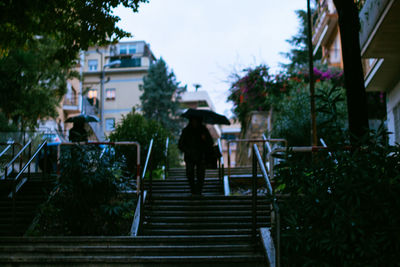 Low angle view of people walking up stairs