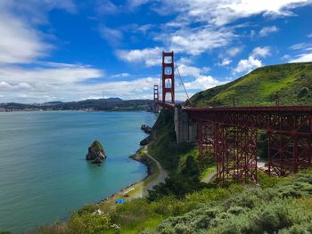 Golden gate bridge over bay against sky