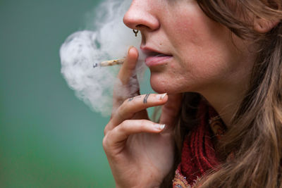 Young woman smoking cigarette