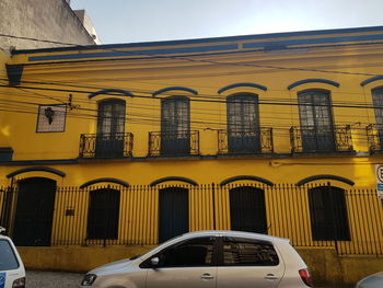 Yellow building against sky