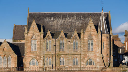 Low angle view of historic building against clear sky