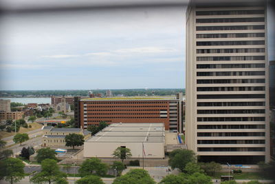 View of buildings against cloudy sky