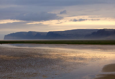 Scenic view of landscape against sky during sunset