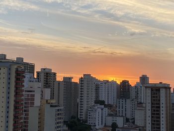High angle view of buildings against sky during sunset