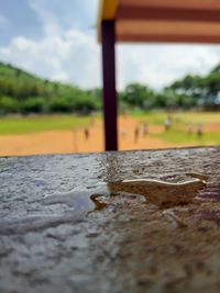 Surface level of sand on field against sky