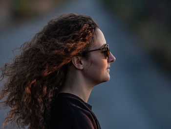 Side view of young woman with long hair