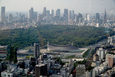 High angle view of buildings in city against sky