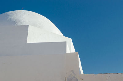 Low angle view of building against blue sky