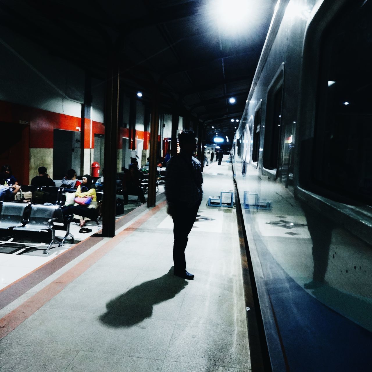 transportation, mode of transport, illuminated, car, city, city life, land vehicle, street, men, walking, architecture, built structure, the way forward, night, full length, lifestyles, rear view, road