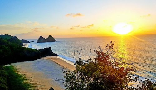 Scenic view of sea against sky at sunset