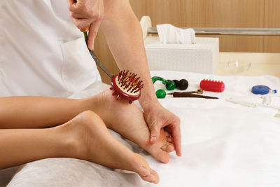 Midsection of woman washing hands