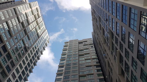 Low angle view of modern buildings against sky