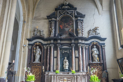 Low angle view of statue against building