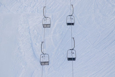 High angle view of ski lift on snow covered field