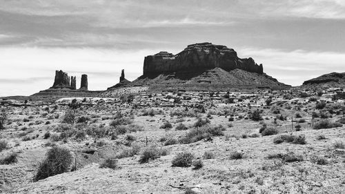 Rock formations on landscape against sky