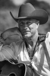 Portrait of man wearing hat standing outdoors