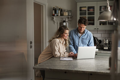Man using mobile phone at home