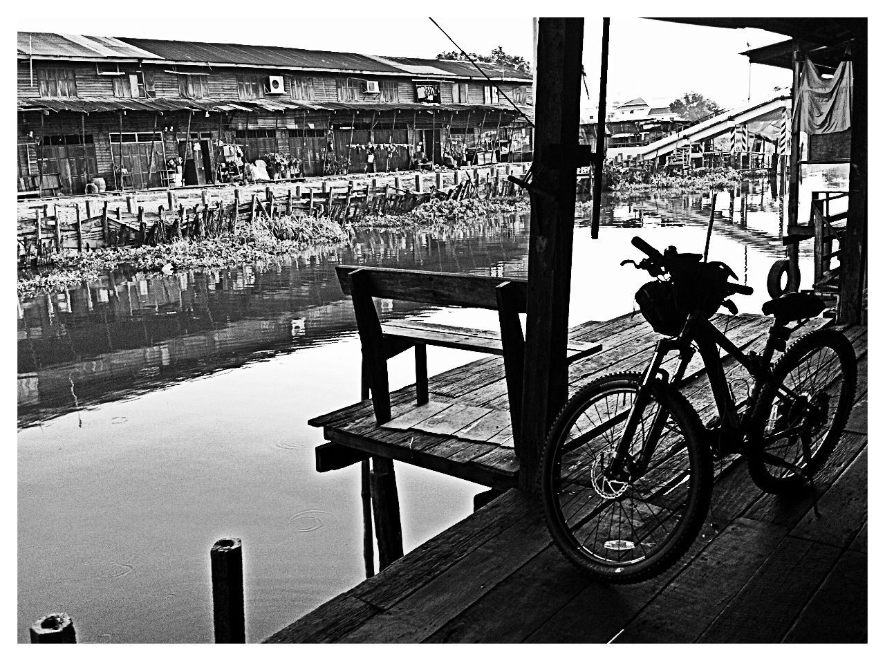 bicycle, transportation, architecture, built structure, mode of transport, building exterior, land vehicle, transfer print, stationary, parked, parking, street, auto post production filter, water, city, day, reflection, car, canal, outdoors