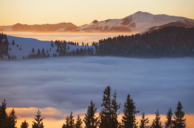 Scenic view of mountains against sky during sunset