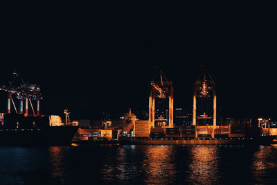 Illuminated buildings in city at night