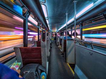 Rear view of people sitting in train