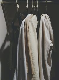 Close-up of clothes hanging in rack